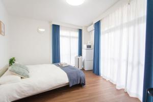 En eller flere senge i et værelse på Natsumi ホテル 2F 成田机场-羽田机场-上野 一线直达