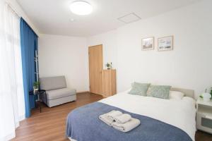 Postel nebo postele na pokoji v ubytování Natsumi ホテル 2F 成田机场-羽田机场-上野 一线直达 + 37 fotografií
