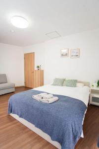En eller flere senge i et værelse på Natsumi ホテル 2F 成田机场-羽田机场-上野 一线直达