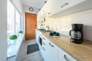 a kitchen with a counter with a blender on it at Willa Morski Klimat in Łeba