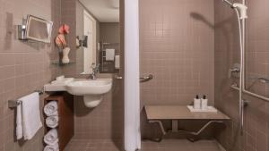 a bathroom with a sink and a shower at InterContinental Brisbane by IHG in Brisbane