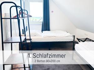 a bedroom with a bunk bed and a window at Casa Lucia Filderstadt, Wohnung mit 4 Zimmer, komplett neu, top für Familen und Geschäftsreisen, super ausgestattet, mit PKW Stellplatz in Filderstadt