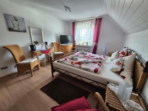 a bedroom with a bed and a living room at Gästehaus Am See in Xanten +89 photos