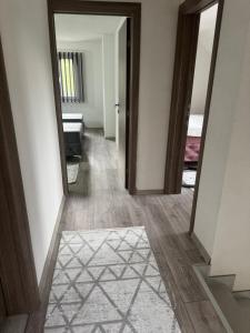 an empty hallway with a door and a mirror at House Sarajka in Sarajevo +10 photos