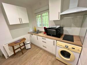 Kuchyň nebo kuchyňský kout v ubytování Le Havre de Paix - Proche Bordeaux et Océan, avec jardin