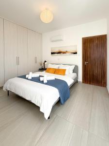 a large bedroom with a large bed in it at Sunset Balcony and Espresso Station Apartment in Larnaka