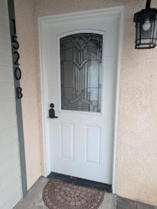 a white door with a glass window on it at Oceano Unit B in Oceano