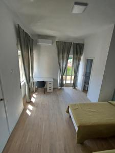 Postel nebo postele na pokoji v ubytování Residenza Cimone