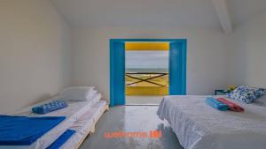 En eller flere senge i et værelse på Casa em Entre Rios com Piscina Beira-Mar