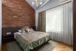 Postel nebo postele na pokoji v ubytování Roze Boutique Hotel