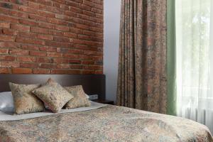 Postel nebo postele na pokoji v ubytování Roze Boutique Hotel