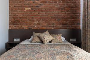 Postel nebo postele na pokoji v ubytování Roze Boutique Hotel