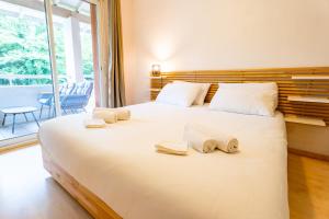 Postel nebo postele na pokoji v ubytování L'appart des pins