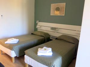 Postel nebo postele na pokoji v ubytování Residenza Cimone