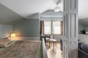 Postel nebo postele na pokoji v ubytování Roze Boutique Hotel