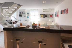 a kitchen with a island with a counter top at Designer apartment in Lefkada