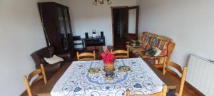 a dining room with a table and chairs at Rosalia Rooms in A Estrada +43 photos