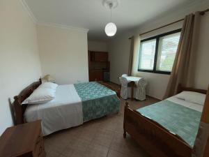 Postel nebo postele na pokoji v ubytování GuestHouse NOVI