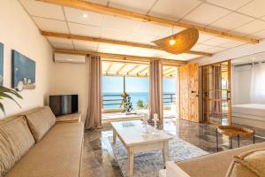 a living room with a couch and a table at Villa Zoi in Sissi