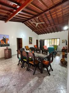 a dining room with a table and chairs at Finca Las Palmas San Gil in San Gil