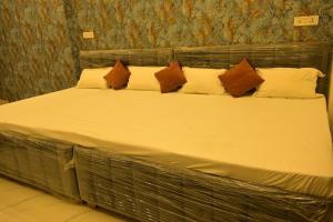 Voodi või voodid majutusasutuse Bajrangbali guest house toas