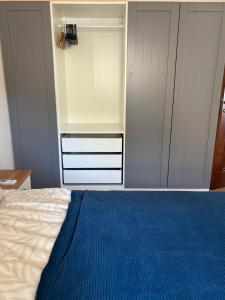 a bedroom with a bed and a white closet at Appartamento Mare e Natura in Castelsardo +9 photos