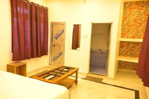Voodi või voodid majutusasutuse Bajrangbali guest house toas