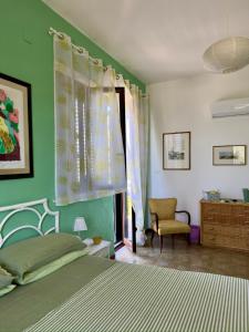 Ένα ή περισσότερα κρεβάτια σε δωμάτιο στο B&B Ondamarina