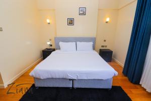 Ένα ή περισσότερα κρεβάτια σε δωμάτιο στο The LoftVue