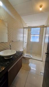 a bathroom with a sink and a toilet and a shower at Condominio 25 in Santa Cruz de la Sierra +17 photos