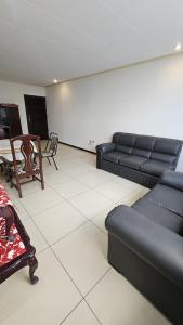 a living room with a couch and a table at Condominio 25 in Santa Cruz de la Sierra