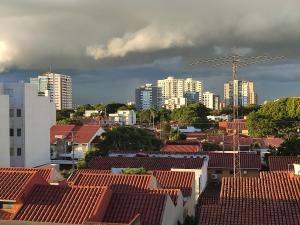 a view of a city with buildings and a windmill at Condominio 25 in Santa Cruz de la Sierra