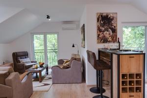a living room with a table and chairs at Vila Dara in Vrnjačka Banja