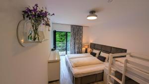 Postel nebo postele na pokoji v ubytování JASMIN HOME Apartments