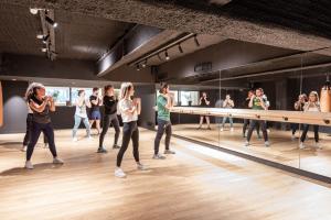 a group of people dancing in front of a mirror at The Babel Community Hôtel - Vieux Port in Marseille +45 photos