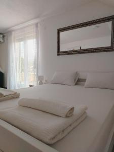 Ένα ή περισσότερα κρεβάτια σε δωμάτιο στο Sunce Bikavac