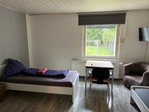 Posezení v ubytování Monteurunterkunft Haus 19 + 1 fotografie