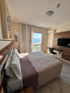 Postel nebo postele na pokoji v ubytování Hotel Torres da Cachoeira