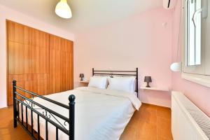 Ένα ή περισσότερα κρεβάτια σε δωμάτιο στο AURA Beach House +50 φωτογραφίες