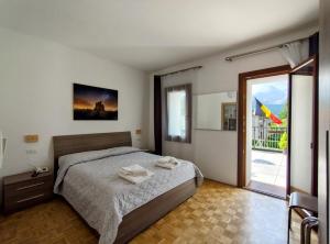 Postel nebo postele na pokoji v ubytování Hotel Da Marco