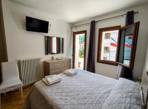 Postel nebo postele na pokoji v ubytování Hotel Da Marco