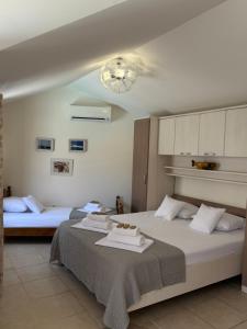 Posteľ alebo postele v izbe v ubytovaní Pucisca Vero Apartments