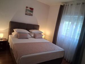 Postel nebo postele na pokoji v ubytování Kuća za odmor Jadra&Sina
