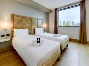 Postel nebo postele na pokoji v ubytování B&B HOTEL Padova