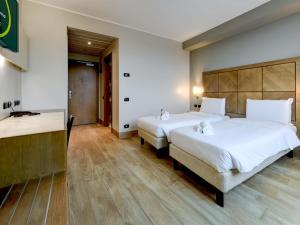 Postel nebo postele na pokoji v ubytování B&B HOTEL Padova