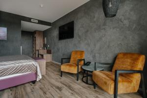 TV a/nebo společenská místnost v ubytování Hotel Kriunes