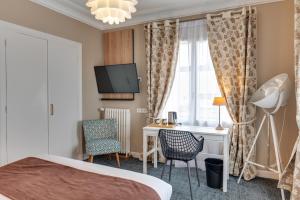 Postel nebo postele na pokoji v ubytování Brit Hôtel Confort Cléria Lorient Centre