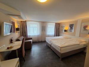 Postel nebo postele na pokoji v ubytování Hotel Garni "Am Ellinger Tor"