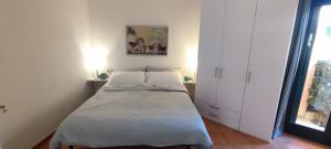 a bedroom with a bed and a window at Casa Maedo in Santa Maria +12 photos