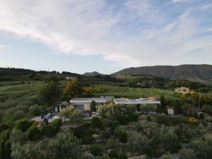 an aerial view of a house in the middle of a field at La Villa des Poètes in Nyons